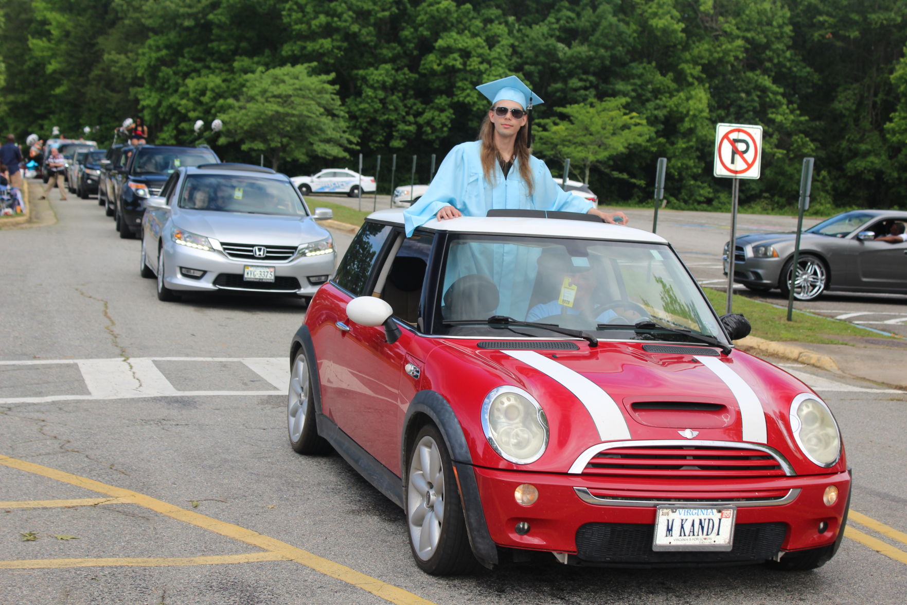 Cameron Noreman riding on top of car